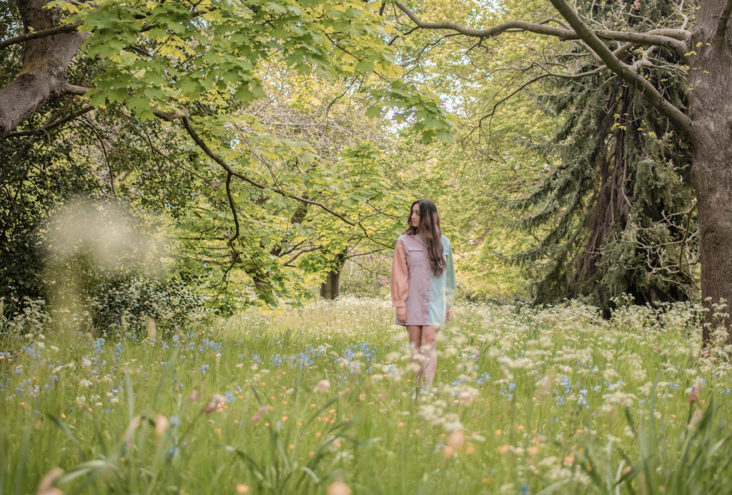 Girl standing in a wildflower field
